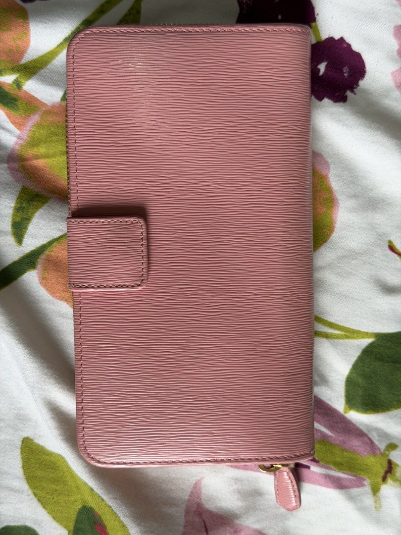 Prada Vitello Move Pink Leather Zip Around Wallet (Category: Luxury Bags & Wallets) located in Manila. Submitted by alexcassan66173 (Listing ID 1459910366, Image 3). Description: - Authentic Prada wallet in a lovely pink shade. - Made in Italy from premium Vitello Move leather. - Secure zip-around closure. - Multiple interior card slots for organization. - Comes with authenticity card and booklet..