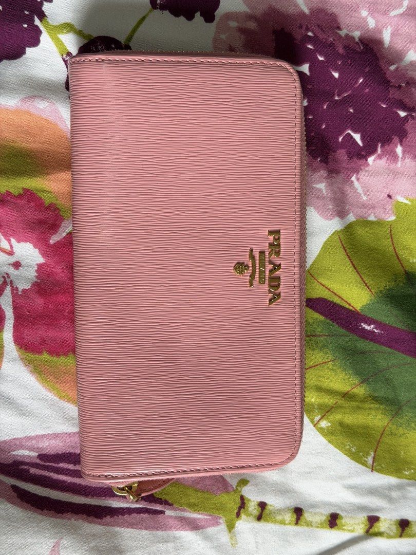 Prada Vitello Move Pink Leather Zip Around Wallet (Category: Luxury Bags & Wallets) located in Manila. Submitted by alexcassan66173 (Listing ID 1459910366, Image 2). Description: - Authentic Prada wallet in a lovely pink shade. - Made in Italy from premium Vitello Move leather. - Secure zip-around closure. - Multiple interior card slots for organization. - Comes with authenticity card and booklet..