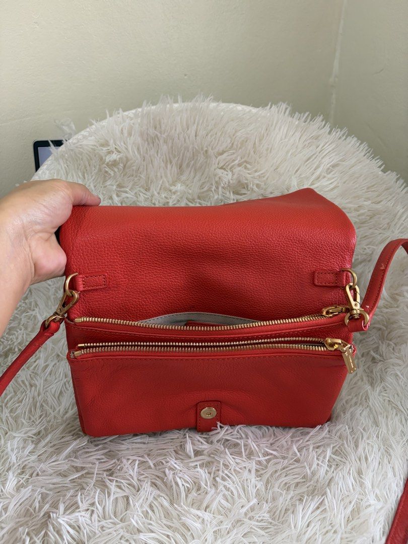 Preloved Couronne Crossbody Bag (Category: Cross-body Bags) located in General Mariano Alvarez. Submitted by maxiscollections (Listing ID 1460047411, Image 3). Description: Preloved Couronne Crossbody Bag Red orange color Like new .