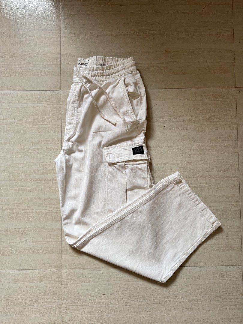 PULL & BEAR OFF WHITE CARGO PANTS (L) (Category: Jeans) located in Manila. Submitted by jelogvtierrez (Listing ID 1459977425, Image 1). Description: Size 32 H: 42" Worn twice (Kazakhstan and Canada Trip) Minor issue: there's no side pocket but may run sa stitch sa loob (see 3rd photo) May have washable stain from storage Shipping via J&T.