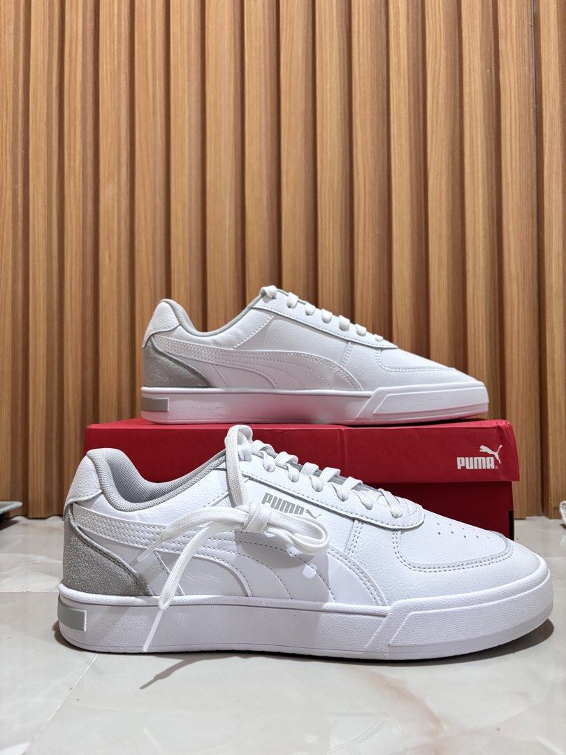Puma White Sneakers with Grey Accents (Category: Sneakers) located in General Trias. Submitted by kibuloid (Listing ID 1460076771, Image 1). Description: - Brand New -Size 9.5 -Classic white Puma sneakers - Grey suede accents on heel and side - Lace-up closure - Puma branding on the sole - Includes original red Puma box - Ideal for everyday casual wear.