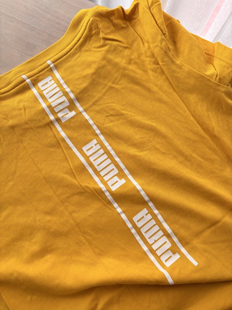 Puma Yellow T-shirt with Logo (Category: Tshirts & Polo Shirts ) located in Manila. Submitted by mitzdcstr6 (Listing ID 1459979820, Image 3). Description: - Vibrant yellow Puma t-shirt - Features the classic Puma logo prominently on the front - Stylish Puma stripe detail runs down the back - Comfortable and casual design - Ideal for everyday wear and a relaxed look.