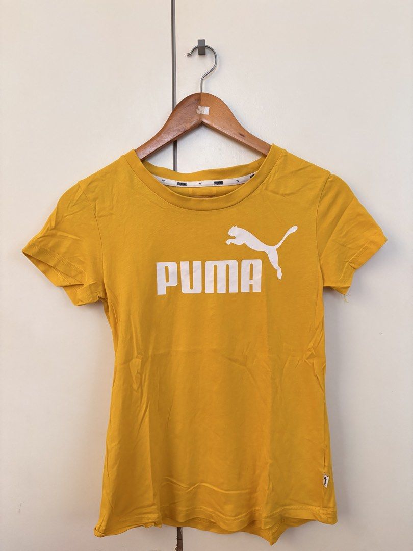 Puma Yellow T-shirt with Logo (Category: Tshirts & Polo Shirts ) located in Manila. Submitted by mitzdcstr6 (Listing ID 1459979820, Image 1). Description: - Vibrant yellow Puma t-shirt - Features the classic Puma logo prominently on the front - Stylish Puma stripe detail runs down the back - Comfortable and casual design - Ideal for everyday wear and a relaxed look.