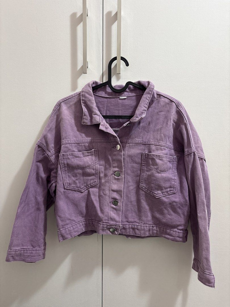 Purple Cropped Denim Jacket (Category: Coats, Jackets and Outerwear) located in Caloocan City. Submitted by preloved_tiffanyycollects (Listing ID 1460102877, Image 1). Description: - Cute cropped denim jacket - Lovely shade of purple - Button-up front closure - Two chest pockets - Raw edge hem finish - Ideal for layering over tops or dresses - Easy to style for a casual look.