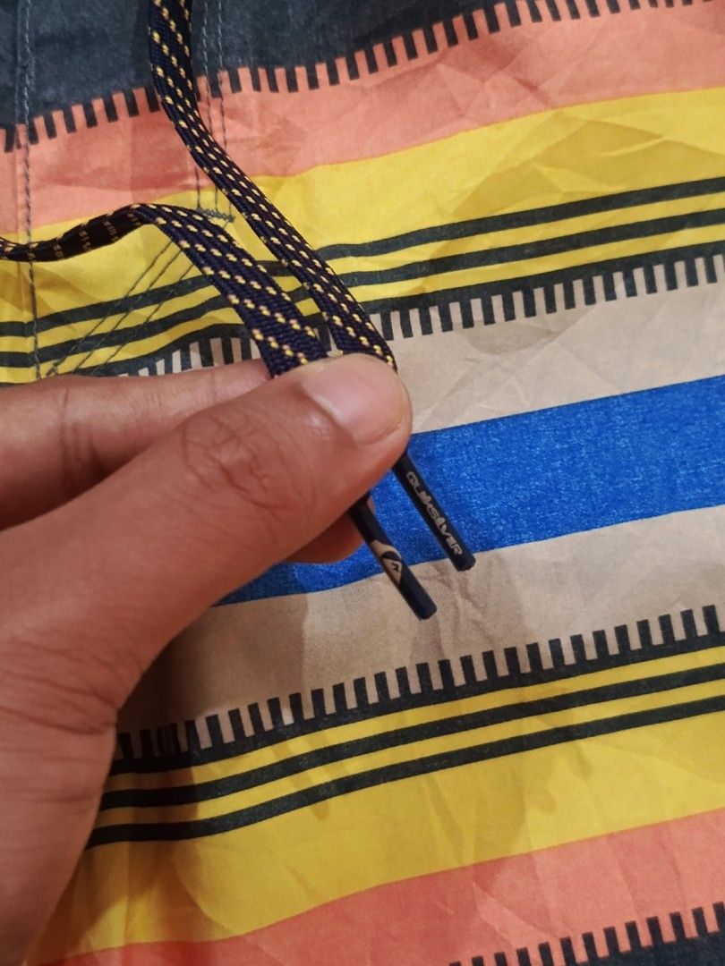 Quiksilver Boardshorts Striped Pattern (Category: Swim Trunks & Board Shorts) located in Cabatuan. Submitted by penthegreat (Listing ID 1460102687, Image 3). Description: AUTHENTIC 🔥🔥🔥 - Quiksilver boardshorts - Cool striped pattern - Drawstring waist with branded ends - Small Quiksilver logo on leg - Ideal for swimming or lounging - Ready for your next beach trip.