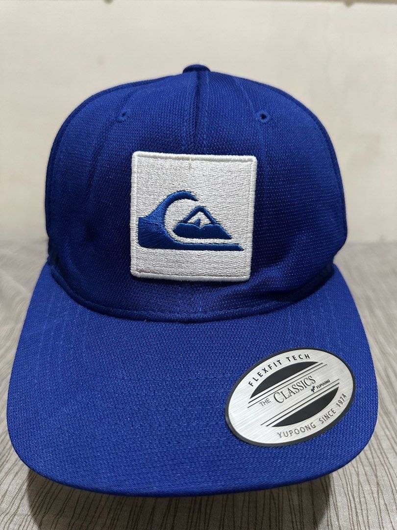 Quiksilver Snapback Cap (Category: Caps & Hats) located in Bacoor. Submitted by realbacktrack (Listing ID 1459906258, Image 2). Description: - Classic blue Quiksilver cap - Features the iconic wave logo on the front - Quiksilver text embroidered on the side and back - Includes Flexfit Tech and The Classics branding - Adjustable strap for a comfortable fit - Ideal for casual wear and everyday styling *needs reshape .