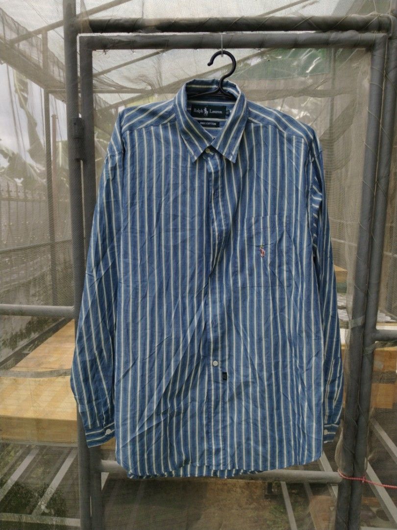 Ralph Lauren longsleeve (Category: Tshirts & Polo Shirts ) located in Legazpi City. Submitted by genobecollectives (Listing ID 1459914434, Image 1). Description: - Classic blue and white striped button-up shirt - Brand: Ralph Lauren - Material: 100% Cotton - Size: 20 - Features: Embroidered logo on chest pocket - Style: Perfect for casual or smart-casual occasions Polo Ralph Lauren longsleeve 800 free ship Size 20 22 x 30 Very good condition My l