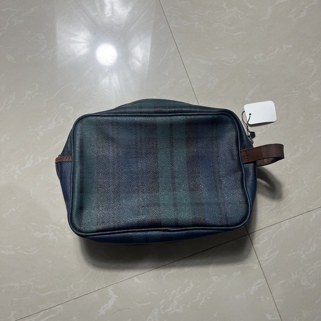 Ralph Lauren Plaid Pouch Bag (Category: Purses & Pouches) located in Manila. Submitted by direcmampu37948 (Listing ID 1459918129, Image 1). Description: - Classic Ralph Lauren plaid design - Genuine leather accents on zipper and handle - Interior zippered pocket for secure storage - Perfect for travel or everyday essentials - Shows some signs of wear on leather and zipper, adding character.