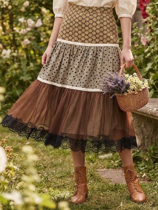 Rare Whimsical / Cottage core skirt (Category: Skirts) located in Cavite. Submitted by wishie_collects (Listing ID 1459803889, Image 1). Description: Design: A whimsical, multi-tiered midi skirt featuring three distinct patterned sections divided by white piping lines. Details: It starts with a brown and beige floral print yoke, flows into an olive green polka-dot ruffled tier, and finishes with a sheer brown tulle layer trimmed with delicate bla