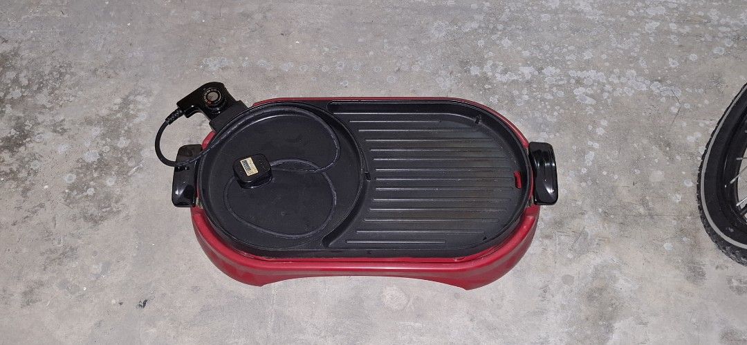 Red Electric Grill Pan with Separate Soup Pot (Category: Cookware & Accessories) located in Manila. Submitted by adaniel.81 (Listing ID 1460081537, Image 1). Description: - Electric grill pan with separate soup/broth section - Ideal for Korean BBQ or hot pot at home - Adjustable temperature control for perfect cooking - Comes with cord and plug - Ready for your next party or family gathering.