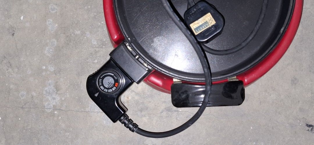 Red Electric Grill Pan with Separate Soup Pot (Category: Cookware & Accessories) located in Manila. Submitted by adaniel.81 (Listing ID 1460081537, Image 2). Description: - Electric grill pan with separate soup/broth section - Ideal for Korean BBQ or hot pot at home - Adjustable temperature control for perfect cooking - Comes with cord and plug - Ready for your next party or family gathering.