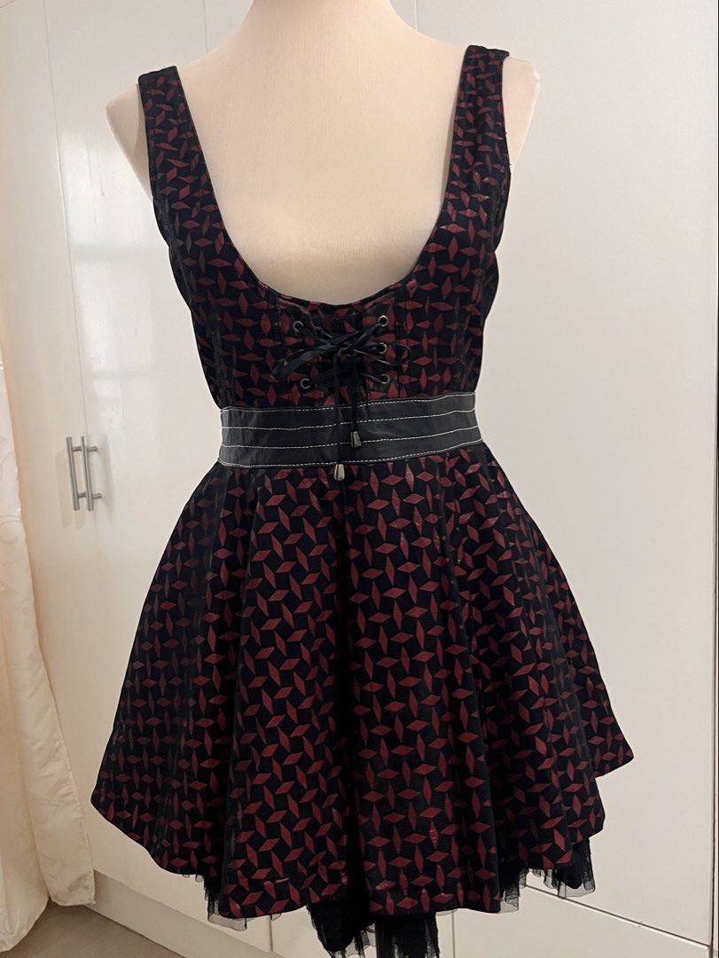 REECHEER Black Red Patterned Lace-Up Mini Dress (Category: Dresses) located in Cabanatuan. Submitted by chinmndz (Listing ID 1460055909, Image 2). Description: Prices are negotiable !! ദ്ദി(˵ •̀ ᴗ - ˵ ) ✧ Feel free to ask for more details. - RECHEER - Color: Black and red pattern - Style: Mini dress - Features: Lace-up front, faux leather belt detail - Skirt: Flared silhouette with black tulle underskirt - Closure: Back zipper - Occasion: Great f