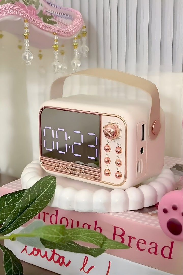Retro Bluetooth Speaker with LED Display (Category: Soundbars, Speakers & Amplifiers) located in Taguig. Submitted by cloverfinds (Listing ID 1460070838, Image 1). Description: - Cute retro-style Bluetooth speaker - Digital LED display shows the time - Includes a convenient carry handle - Features USB and AUX ports - Chic rose gold accents - Perfect for music lovers with a vintage aesthetic.