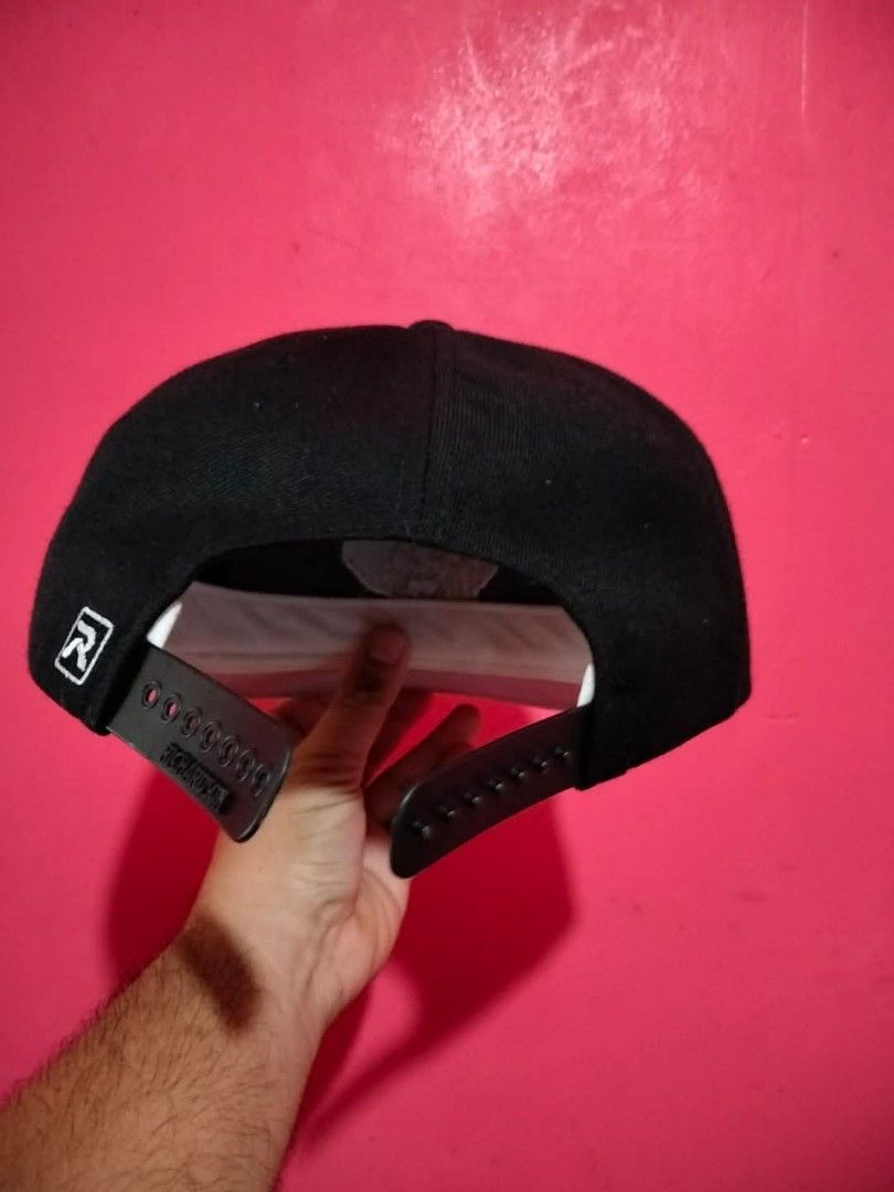 Richardson Black Pirate "P" Snapback Cap (Category: Caps & Hats) located in Mangaldan. Submitted by niftythrifty69 (Listing ID 1459958273, Image 3). Description: - Brand: Richardson - Style: 410 Snapback Cap - Color: Black - Features: Embroidered pirate 'P' logo on front, flat brim - Closure: Adjustable snapback - Condition: Minimal signs of wear - Perfect for: Casual wear, streetwear style.