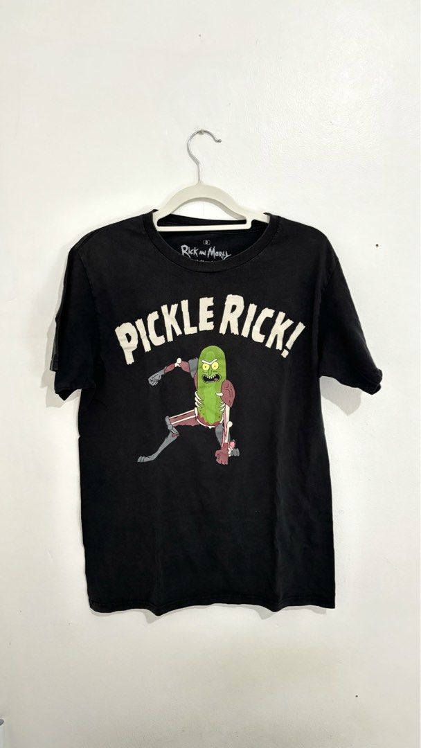 Rick and Morty “Pickle Rick!” Graphic Tee (Category: Shirts) located in Caloocan City. Submitted by buymethisandthat (Listing ID 1460009530, Image 1). Description: ✨ Black Rick and Morty “Pickle Rick!” Graphic Tee - ₱149 📌 CONDITION • Condition: 8/10 • Flaws: Light fabric wash wear, collar fading 📏 SIZE • Tag Size: Small • Recommended: Fits Small to Medium.