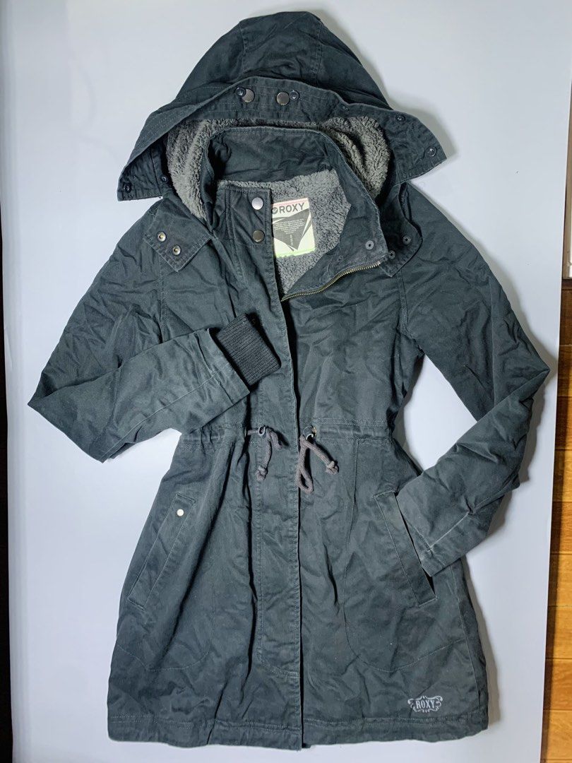 Roxy Grey Hooded Parka Jacket with Fleece Lining (Category: Coats, Jackets and Outerwear) located in Dagupan City. Submitted by sj_styles0910. (Listing ID 1460095892, Image 1). Description: - Grey Roxy parka jacket - Warm fleece lining inside - Hooded design with adjustable drawstring waist - Secure button and zip closure - Ribbed cuffs for added warmth - Roxy logo detail on lower front - Ideal for cooler weather.