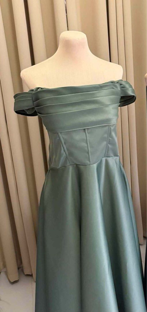 Sage Green Off-Shoulder Gown (Category: Dresses) located in Manila. Submitted by myct27 (Listing ID 1459912068, Image 2). Description: For sale! 💚✨ Selling my two sage green gowns, both used once only. 👗 Gazar Gown • XL size • With slit and pockets • ₱1,800 negotiable 👗 Duchess Gown • XL size • With slit and pockets • ₱1,600 negotiable 📍 Norzagaray, Bulacan / Makati City Message me na lang for more details, measurements, and photos! 😊.