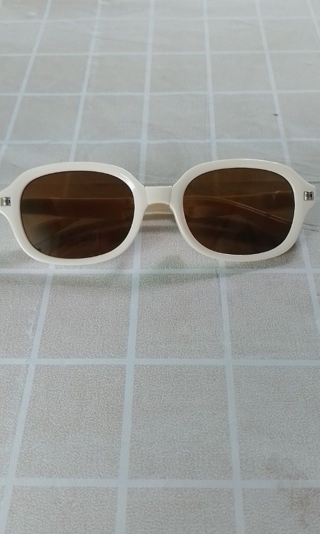 Sale!!!Foldable Sunglasses (Category: Sunglasses & Eyewear) located in Batangas. Submitted by zenrez_shop (Listing ID 1459990324, Image 1). Description: Anti UV 400 Foldable eyeglasses for women or men Color Beige frame brown tea lens.