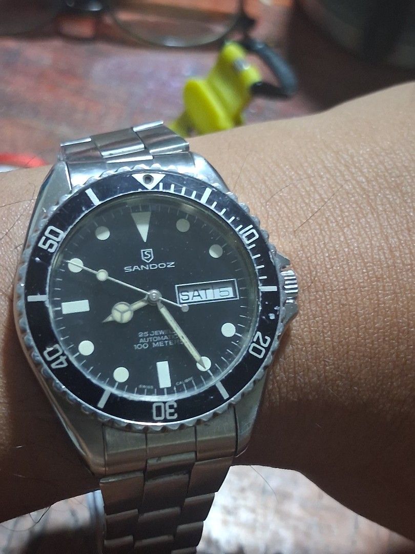 Sandoz Automatic Dive Watch 100 Meters (Category: Men's Watches) located in Pasig City. Submitted by superjun_ (Listing ID 1460082011, Image 1). Description: - Sandoz automatic watch - Black dial with day and date function - Water resistant up to 100 meters - Stainless steel bracelet - Shows some signs of wear on bezel and bracelet - Solid timepiece for everyday wear or diving -hard to find .