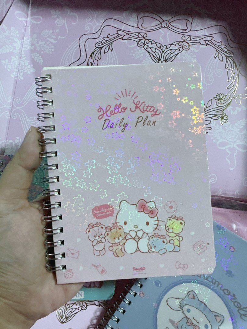 Sanrio Daily Plan Notebooks - Hello Kitty, Cinnamoroll, Hangyodon (Category: Stationery & School Supplies) located in Manila. Submitted by ronoarabbit.ph (Listing ID 1460013834, Image 1). Description: Sanrio Daily Plan Notebooks - Hello Kitty, Cinnamoroll, Hangyodon — 100 php each - Choose from adorable Kitty, Cinnamoroll, or Hangyodon designs. - Features a dazzling holographic cover for a touch of magic. - Inside, find a fun and organized layout