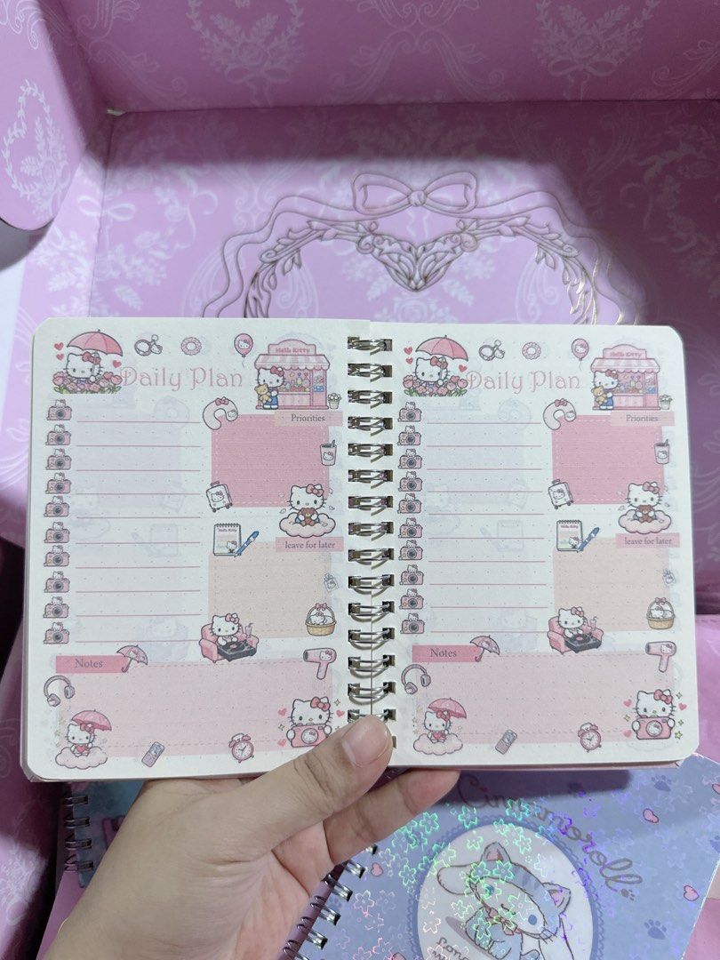 Sanrio Daily Plan Notebooks - Hello Kitty, Cinnamoroll, Hangyodon (Category: Stationery & School Supplies) located in Manila. Submitted by ronoarabbit.ph (Listing ID 1460013834, Image 2). Description: Sanrio Daily Plan Notebooks - Hello Kitty, Cinnamoroll, Hangyodon — 100 php each - Choose from adorable Kitty, Cinnamoroll, or Hangyodon designs. - Features a dazzling holographic cover for a touch of magic. - Inside, find a fun and organized layout