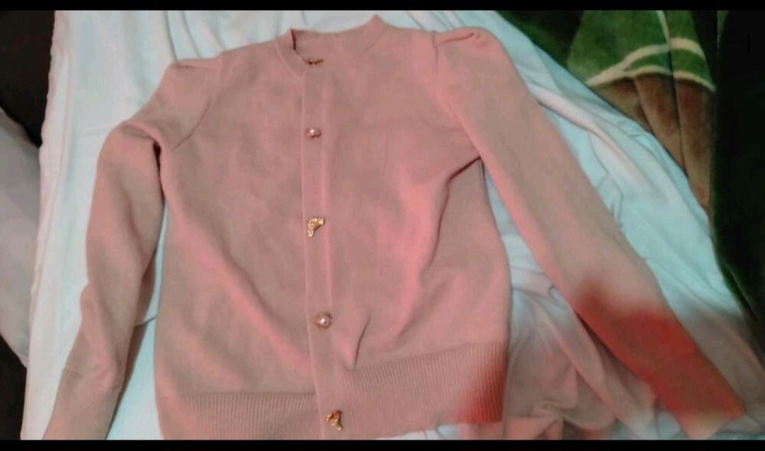 SHEIN Pink Puff Sleeve Cardigan (Category: Coats, Jackets and Outerwear) located in Makati City. Submitted by madame.kaye (Listing ID 1459930350, Image 2). Description: BUST 35.4 Length -27.1 Used once, it was too loose for me so this would be perfect for Medium size - Adorable pink cardigan - Features stylish puff sleeves - Unique gold button details - Comfortable ribbed cuffs and hem - Made from soft knit material - Versatile for layering or st