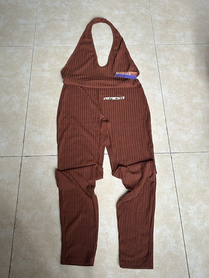 SHEIN Ribbed Halter Neck Jumpsuit (Category: Jumpsuits) located in Pasig City. Submitted by eddwuhrd (Listing ID 1459991046, Image 1). Description: - SHEIN brown ribbed jumpsuit - Halter neck with deep V-neck - Full length pants - Comfortable and stylish - Perfect for night outs or casual wear - Versatile: easy to dress up or down.