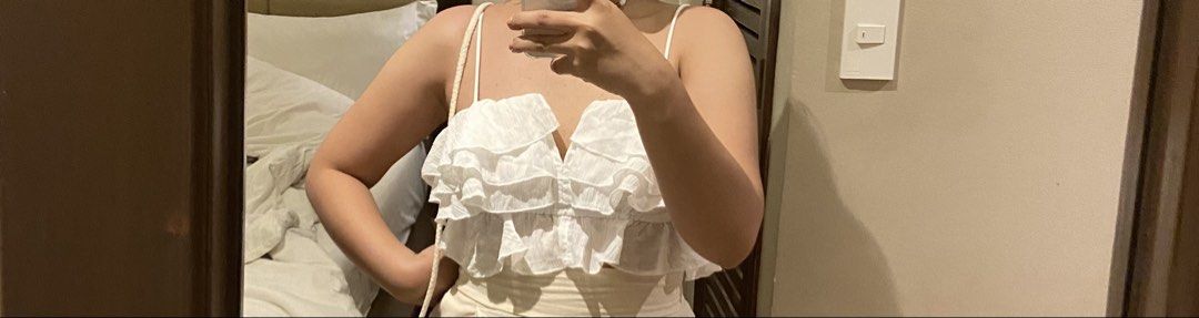 SHEIN SXY White Ruffle Crop Top (Category: Others Tops) located in Manila. Submitted by maggieberry (Listing ID 1460100010, Image 3). Description: - Cute white crop top - Features delicate ruffles - Spaghetti straps - Smocked back for a comfortable fit - Versatile: pairs well with high-waisted pants or skirts - Perfect for night outs or casual days - Trendy and stylish design.