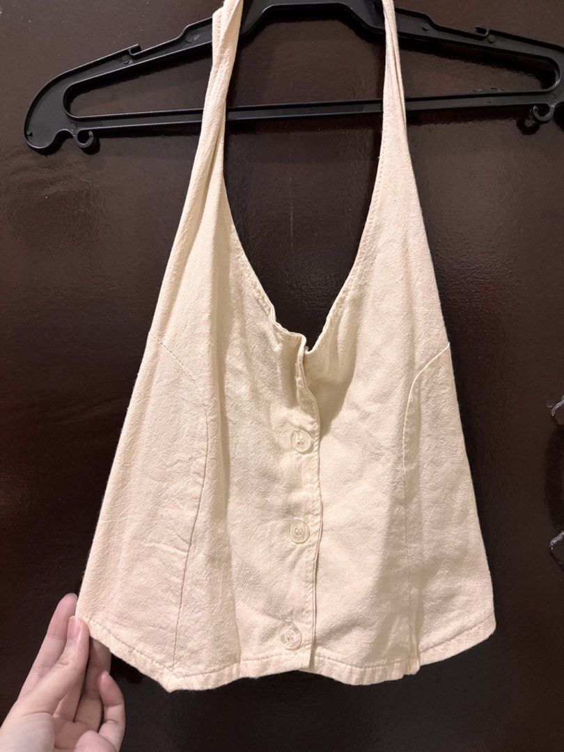 Sierra Manila Beige Halter Neck Button Up Top (Category: Blouses) located in Valenzuela. Submitted by chamenamena (Listing ID 1459969245, Image 1). Description: - Beige halter neck top - Brand: Sierra Manila - Features: Button-up front, smocked back, ties at the neck - Material: Lightweight fabric - Style: Casual wear - Estimated Size: Small to Medium.