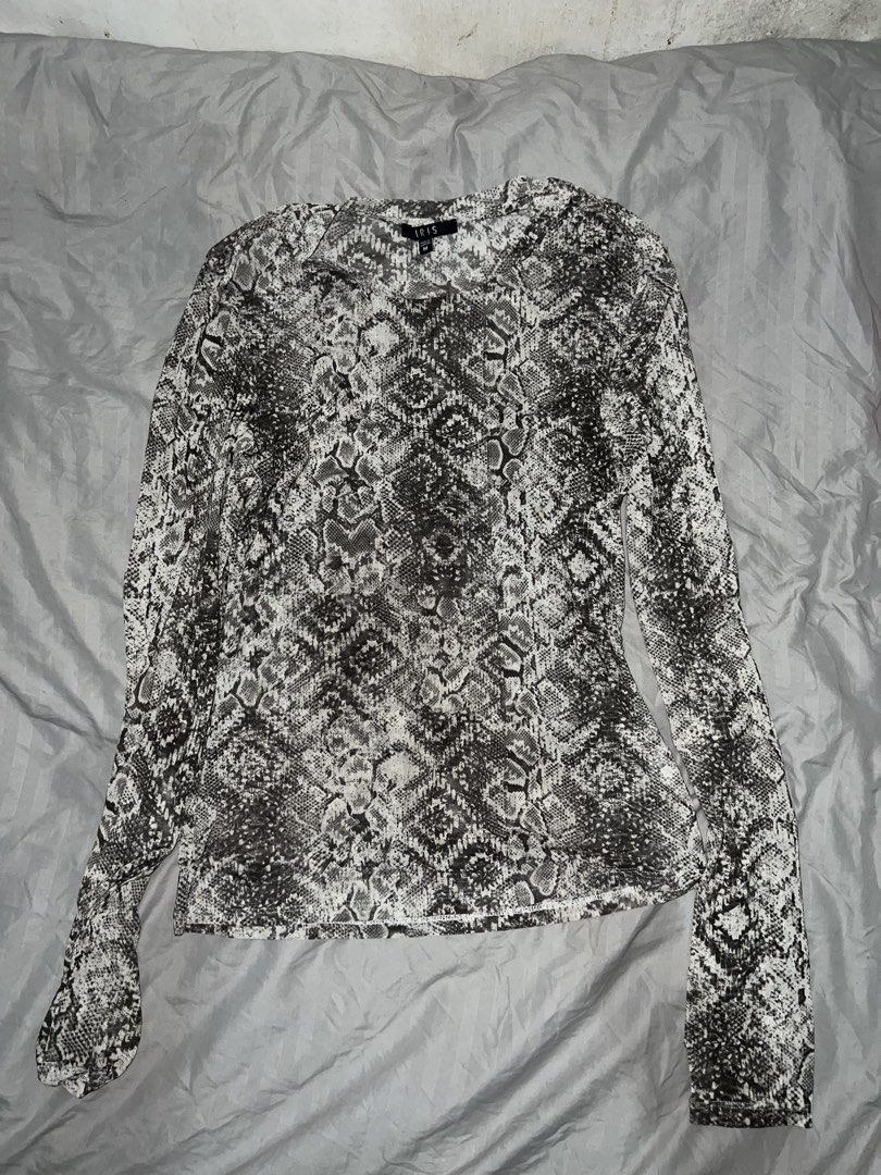 Snake print Mesh top (M) (Category: Longsleeves) located in Paranaque City. Submitted by michcianox (Listing ID 1460013312, Image 1). Description: Longsleeves mesh top in snake print pattern Brand: IRIS M on tag Price does not include shipping fee Can ship through lalamove 📍meet up location: SM Sucat 💵 payment through gcash/maya Comfy material even though it’s mesh, last photo shows when worn (used only once) and I tied the back to sinch the wa