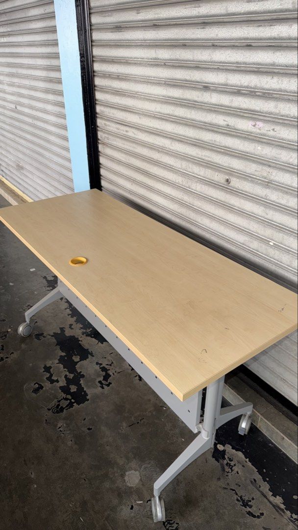 Solid Foldable Office Table with Wheels (Category: Tables & Sets) located in Kuala Lumpur. Submitted by adelaqel (Listing ID 1459999054, Image 2). Description: - Light wood top office table - Sturdy metal frame and base - Easy mobility with wheels - Stylish perforated front panel - Convenient cable management hole - Ideal for office or study - Folds for easy storage.
