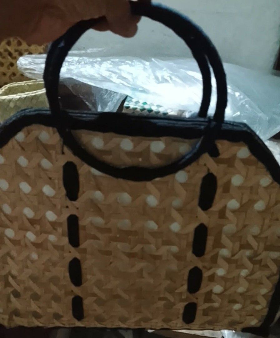 Solihiya weave pattern bags (Category: Tote Bags) located in Muntinlupa City. Submitted by melora04 (Listing ID 1460008709, Image 2). Description: woven bamboo handbag wooden top handles, and a black fabric trim with a button closure.