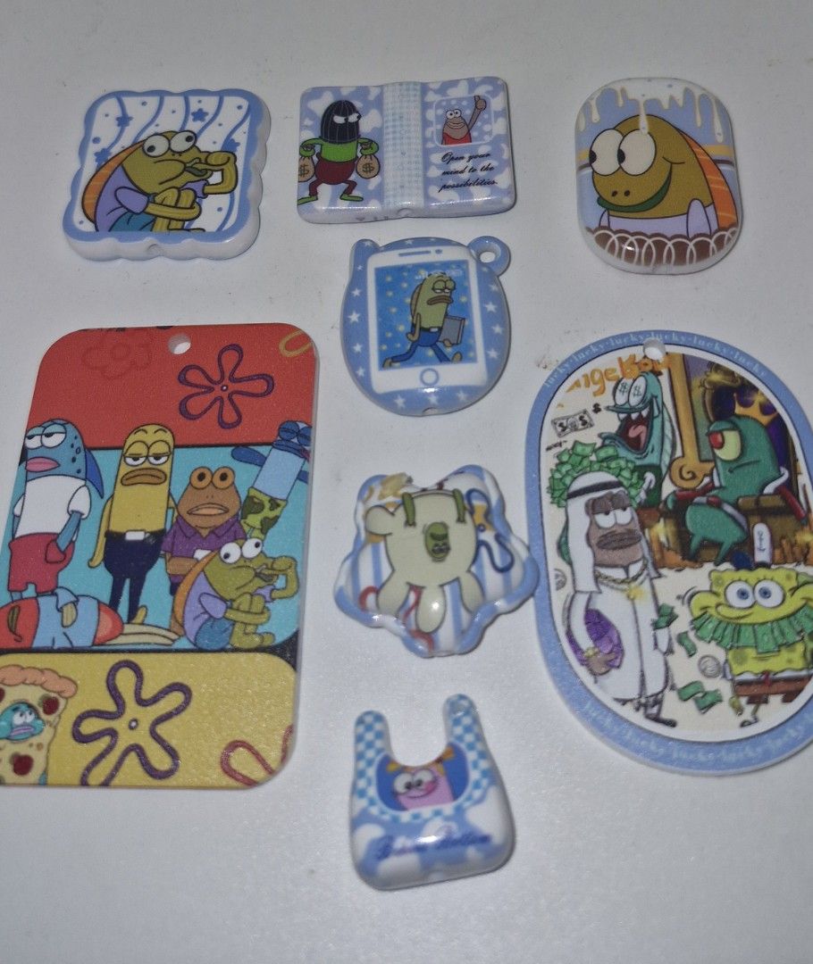Spongebob Bikini bottom buddies charms set (Category: Character Goods) located in Quezon City. Submitted by belikabim2014 (Listing ID 1459915305, Image 1). Description: - Adorable SpongeBob bikini bottom buddies charms set - Some charms feature phone or book designs - Ideal for decorating bags, keychains, and DIY crafts - A must-have collectible for any SpongeBob enthusiast.
