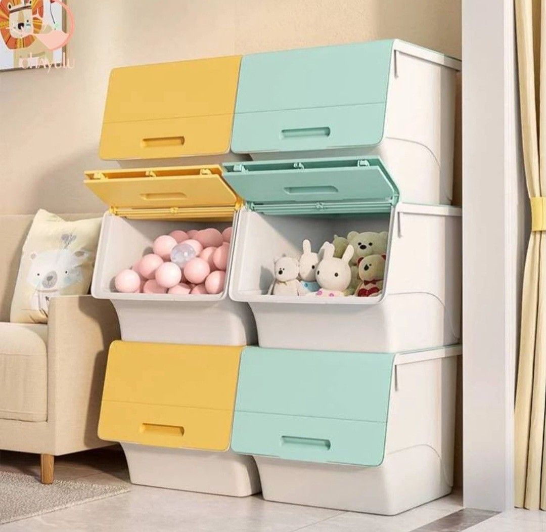 Stackable Storage Boxes with Lids (Category: Storage Boxes & Baskets) located in Singapore. Submitted by maximami (Listing ID 1459919113, Image 1). Description: 2 light green storage boxes. (no yellow box) 1 box: $5 2 boxes at $10. (Originally bought at $24 for both boxes.) Top up $8 for all soft toys shown in last picture - lightweight - They have flip-up lids for easy access. - Great for organizing toys, clothes, or other household items. - Can