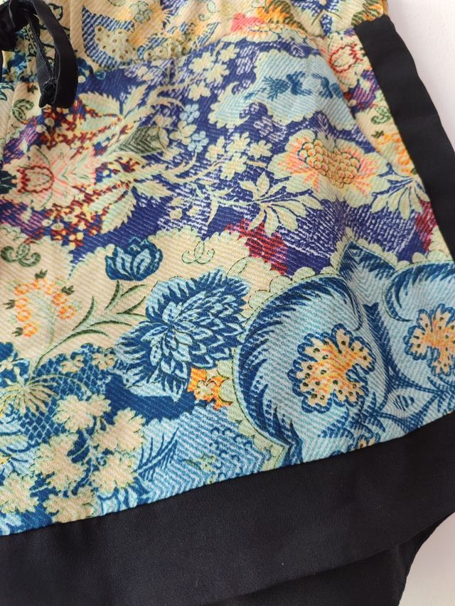 Stradivarius Printed Bohemian Summer Shorts (Category: Shorts) located in Las Pinas. Submitted by drecessionista (Listing ID 1460063327, Image 3). Description: - Vibrant floral print shorts - Black trim on sides and hem - Elastic waistband with drawstring tie - Ideal for lounging or casual outings - Easy to style with basic tops.