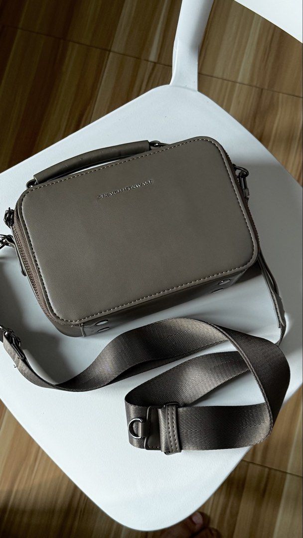 (Bundle of 2) Straightforward Bags (Category: Cross-body Bags) located in Quezon City. Submitted by shopwithkyle (Listing ID 1459936773, Image 3). Description: - RFS: DECLUTTERING - Bundle includes two Straightforward bags (Worth ₱3,000 in SRP) - Versatile neutral color (Taupe) - Both bags feature adjustable and detachable straps. - Made from Daily Vegan Leather (Well kept, No Molds).