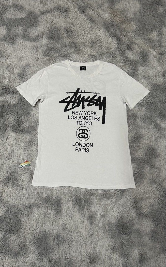 St*ssy tee (Category: Tshirts & Polo Shirts ) located in Manila. Submitted by paulovenegaskalakal2020 (Listing ID 1460010084, Image 1). Description: For sale Kalakal St*ssy world tour tee Off- good for psg Medium- 20 width x 29.5 length inches Penhole & dot stain Sign of usage Good MINE 799 +sf.