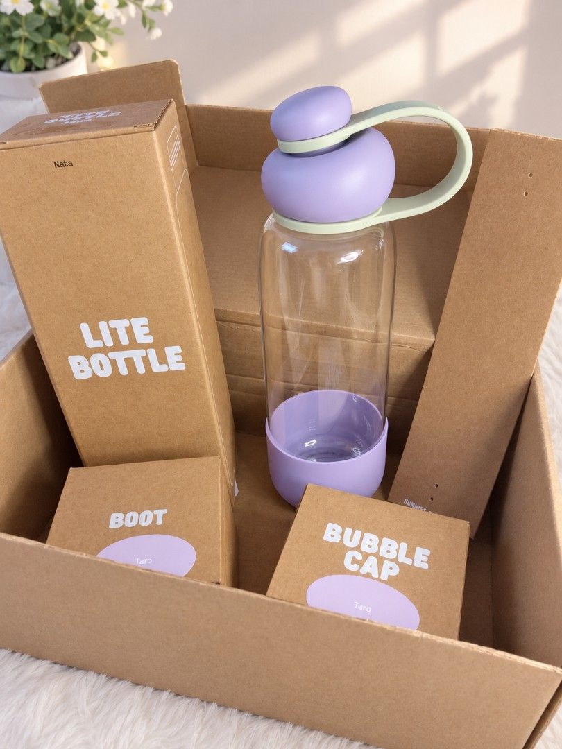 Sunnies flask (Category: Water Bottles & Tumblers) located in Manila. Submitted by fastdragon-916d (Listing ID 1459948062, Image 1). Description: - Sunnies Bottle set - Includes: Bottle, Taro-colored boot, Taro-colored bubble cap - Comes in original packaging - Ideal for everyday use or as a gift.