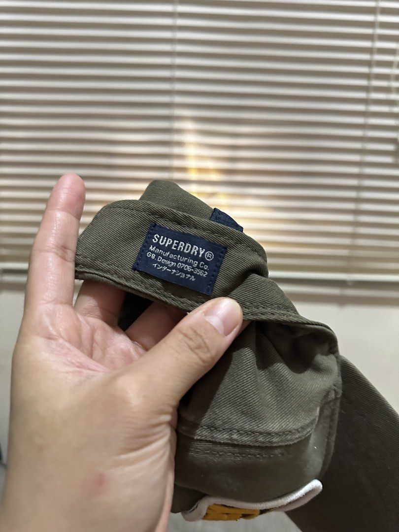 Superdry New York State Co. Patch Cap (Category: Caps & Hats) located in Bacoor. Submitted by realbacktrack (Listing ID 1459910167, Image 3). Description: - Superdry cap in olive green - Features a New York patch - Distressed details on the brim for a worn-in look - Adjustable strap at the back for a custom fit - Comes with original tag, brand new - Ideal for everyday casual wear .