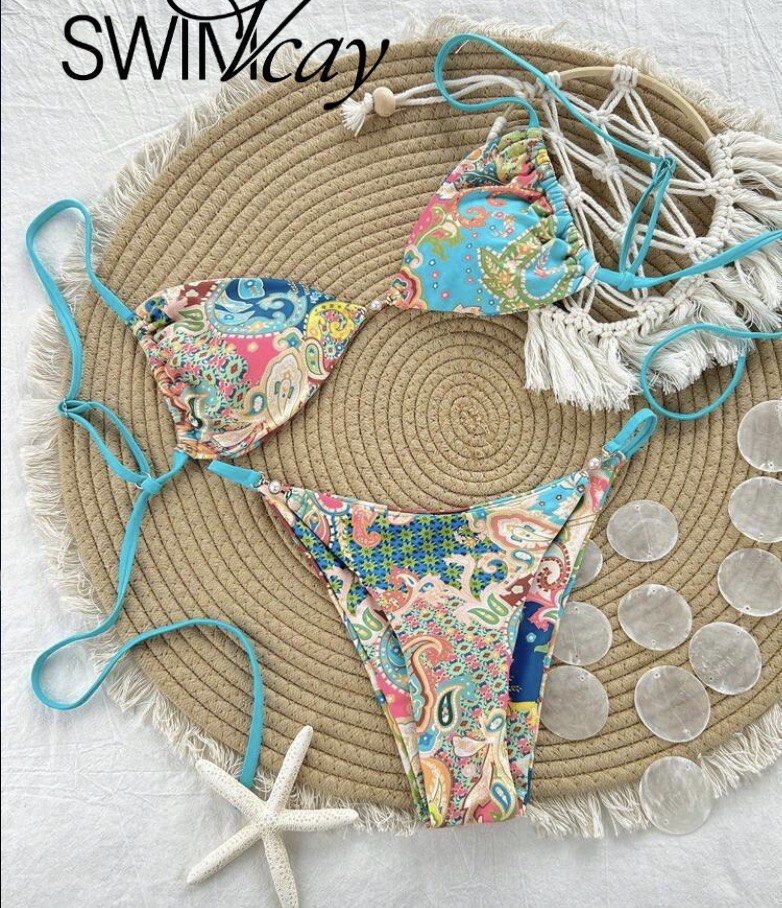 SWIMCAY Paisley Print Triangle Bikini (Category: Bikinis & Swimsuits) located in Cebu City. Submitted by loysilo (Listing ID 1460051826, Image 1). Description: SWIMCAY bikini set with a vibrant paisley print. Features a triangle top and matching bottoms. Perfect for beach or pool days! Only ₱200.