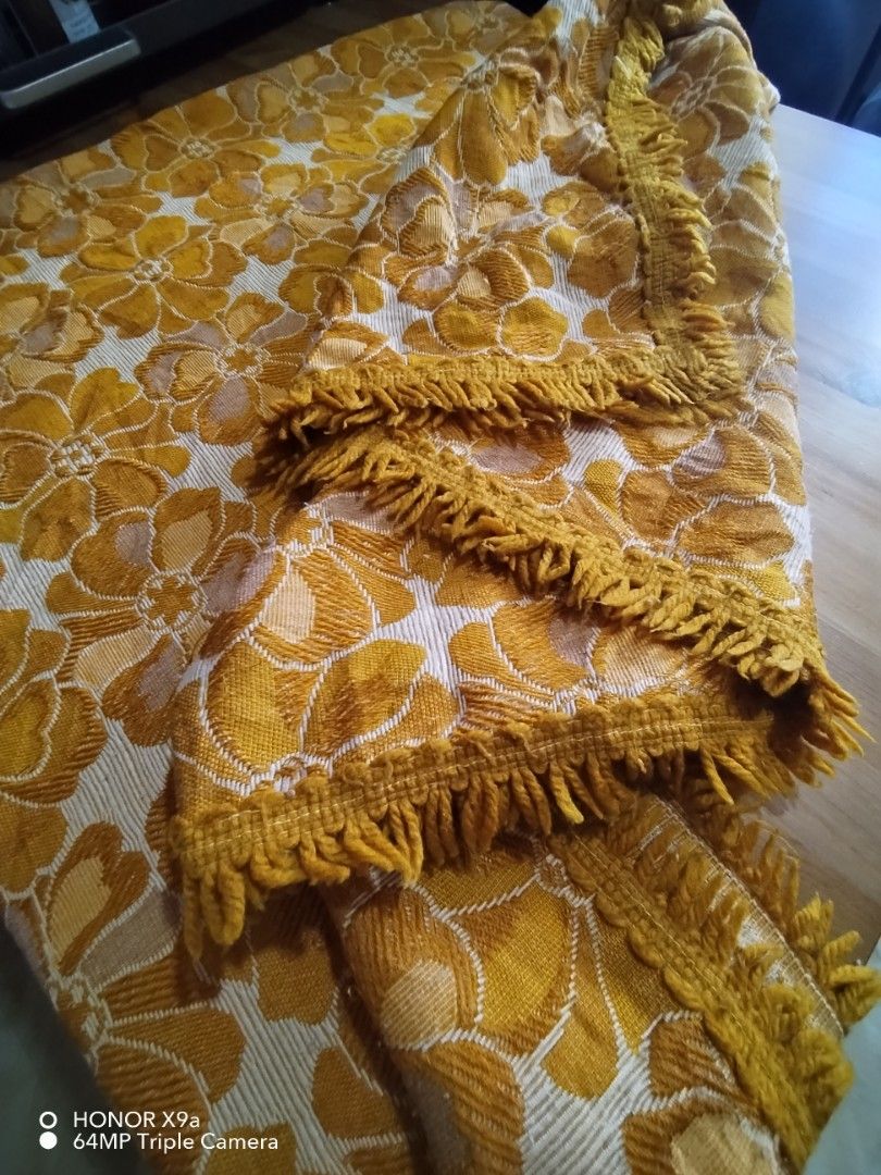 Table Topper 6to 8 strs w/ Flaws (Category: Table Linen & Textiles) located in Muntinlupa City. Submitted by arciagamaryann68 (Listing ID 1459949211, Image 1). Description: - Vintage-style table topper - Features a yellow and cream floral pattern - Textured fabric with fringe trim - Please note: item has flaws as indicated in the title - Adds a decorative touch to tables.