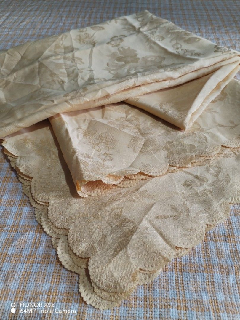 Table Topper ( 4 seaters) (Category: Table Linen & Textiles) located in Muntinlupa City. Submitted by arciagamaryann68 (Listing ID 1459945046, Image 2). Description: - Beautiful yellow table topper - Features an elegant floral damask pattern - Delicate scalloped lace trim along the edges - Perfect for adding a touch of sophistication to your dining table - Enhances table setting for special occasions or daily use.