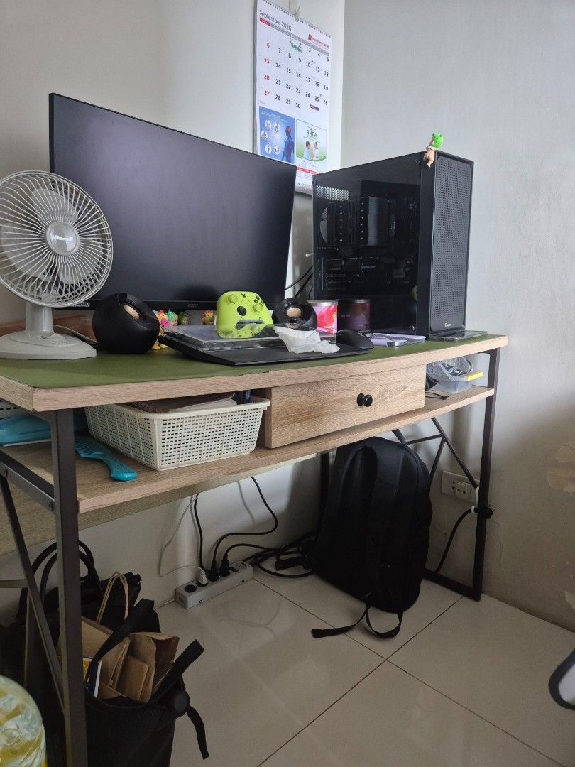 Table with Single Drawer (With Metal Legs) (Category: Tables & Sets) located in Las Pinas. Submitted by notadagencygirl (Listing ID 1460036038, Image 2). Description: TABLE WITH SINGLE DRAWER (METAL LEGS) - Bought from Our Home in 2017 at P8,500 - Has damages on tabletop but can be covered by desk mat - Strong metal legs - Has single drawer - Good for as study table, PC setups - Well-maintained and cleaned regularly RFS: Downsizing ⚠️ CONTENTS ON