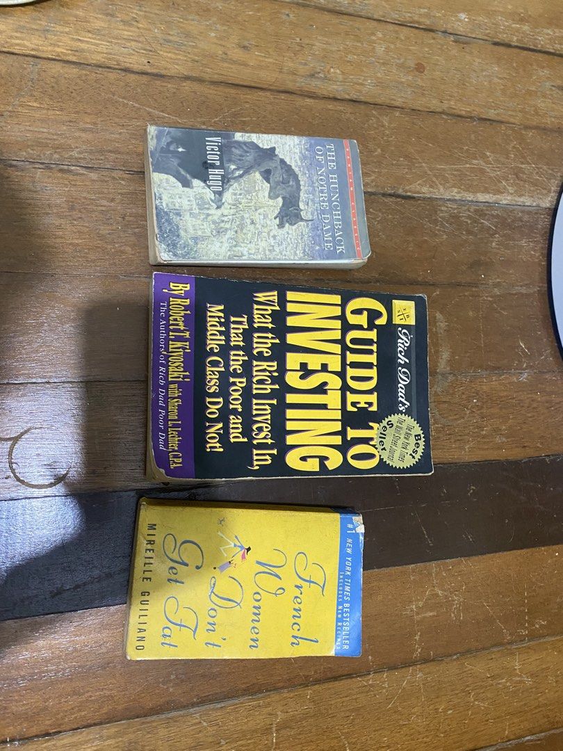 Take all books for sale (Category: Storybooks) located in Manila. Submitted by nicolezald25729 (Listing ID 1460067835, Image 1). Description: - 'Guide to Investing: What the Rich Invest In, That the Poor and Middle Class Do Not!' by Robert T. Kiyosaki - 'French Women Don't Get Fat' by Mireille Guiliano - 'The Hunchback of Notre Dame' by Victor Hugo - Perfect for readers interested in finance, lifestyle, and classic literature. Take all books 📚 w