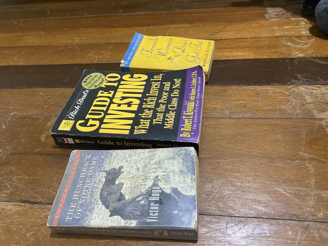 Take all books for sale (Category: Storybooks) located in Manila. Submitted by nicolezald25729 (Listing ID 1460067835, Image 2). Description: - 'Guide to Investing: What the Rich Invest In, That the Poor and Middle Class Do Not!' by Robert T. Kiyosaki - 'French Women Don't Get Fat' by Mireille Guiliano - 'The Hunchback of Notre Dame' by Victor Hugo - Perfect for readers interested in finance, lifestyle, and classic literature. Take all books 📚 w