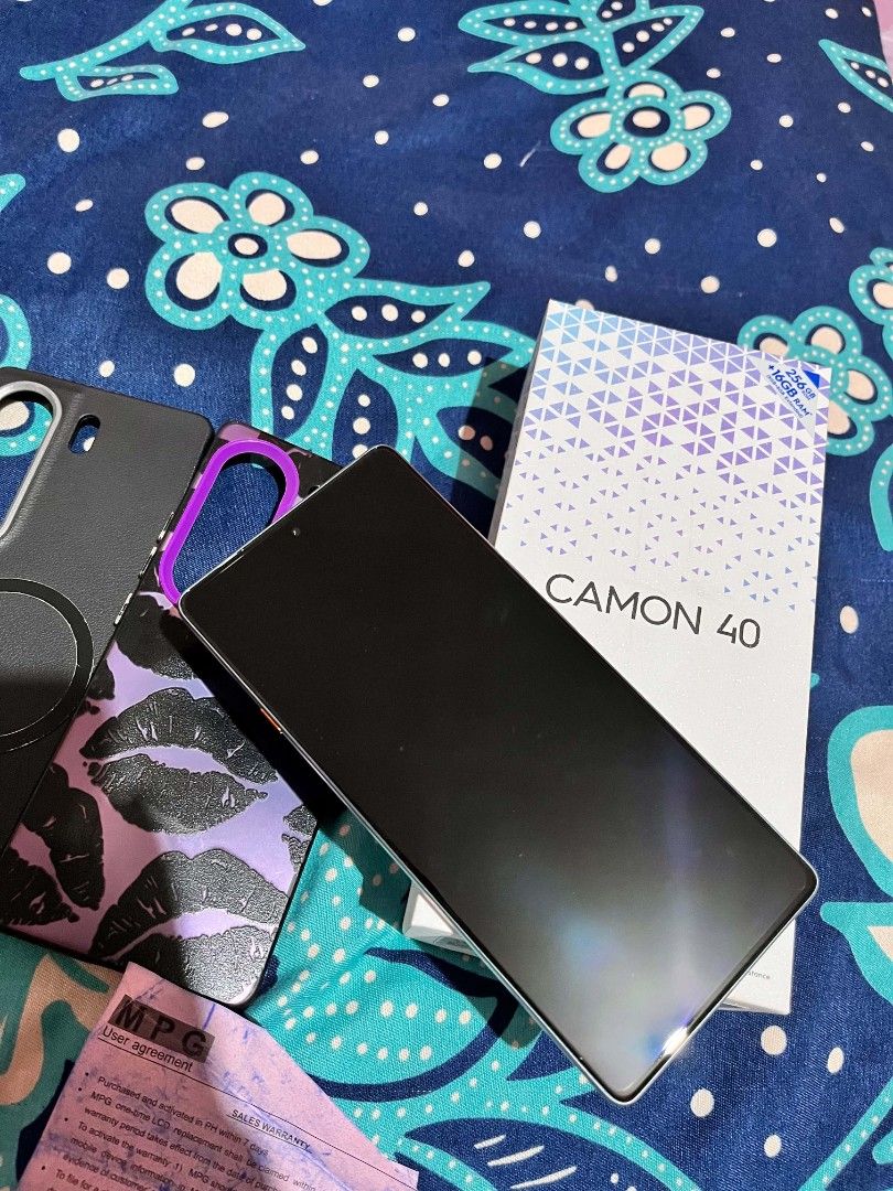 TECNO CAMON 40 (Category: Android Others) located in Quezon City. Submitted by dnlsrb (Listing ID 1460025687, Image 2). Description: COMPLETE BOX WITH ORIGINAK CHARGER AND CASE.