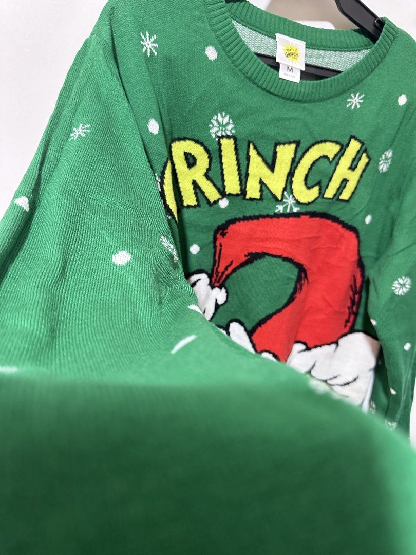 The Grinch Green Christmas Sweater (Category: Longsleeves) located in Calamba. Submitted by berngundy (Listing ID 1459974014, Image 3). Description: - Green Grinch Christmas sweater - Ideal for holiday parties or casual wear - Size: Medium (M) to Large - Worn once, bought in Australia - Material: Cozy knit .