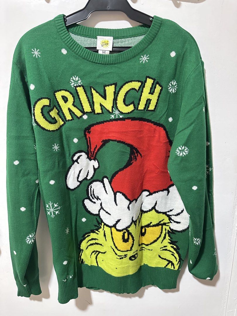 The Grinch Green Christmas Sweater (Category: Longsleeves) located in Calamba. Submitted by berngundy (Listing ID 1459974014, Image 1). Description: - Green Grinch Christmas sweater - Ideal for holiday parties or casual wear - Size: Medium (M) to Large - Worn once, bought in Australia - Material: Cozy knit .