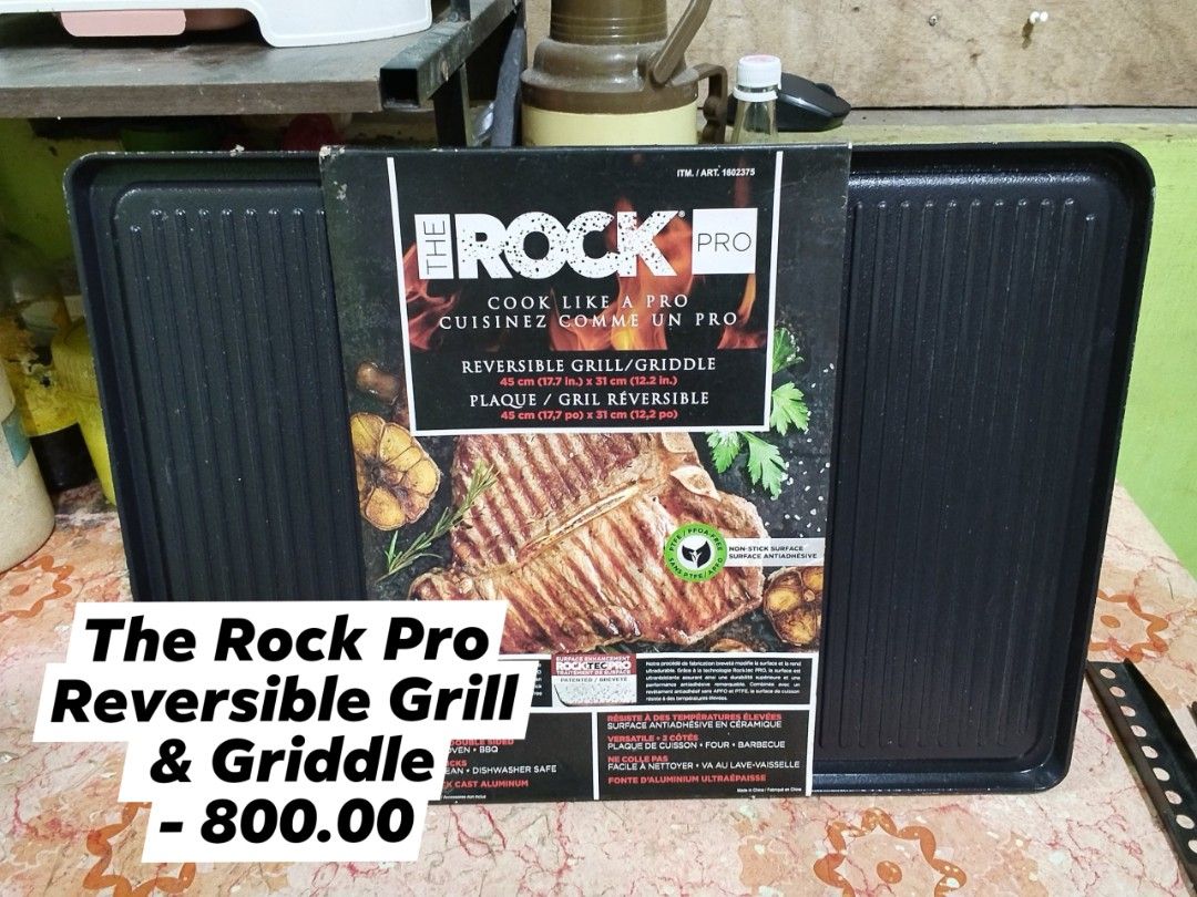 The Rock Pro Reversible Grill & Griddle 45cm (Category: BBQ, Grills & Hotpots) located in Malabon City. Submitted by naughty_09 (Listing ID 1459956251, Image 1). Description: - Versatile 2-in-1 grill and griddle - Size: 45cm (17.7 in.) x 31cm (12.2 in.) - Ultra-thick cast aluminum construction - Non-stick surface for easy cooking and cleaning - Dishwasher safe - Ideal for everyday kitchen use.