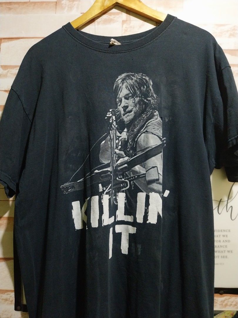 The Walking Dead "KILL IT" T-Shirt AMC (Category: Tshirts & Polo Shirts ) located in Taguig. Submitted by lumangdamit (Listing ID 1460063296, Image 1). Description: - Black t-shirt featuring Daryl Dixon from The Walking Dead. - "KILL IT" graphic on the front. - Officially made by AMC. - Perfect for fans of the show. - Shows some signs of wear (please check photos for condition). - Still has plenty of life left. - 23x28 Dimes - Multiple pinholes.
